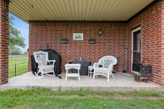 a couple of chairs sitting in backyard of house