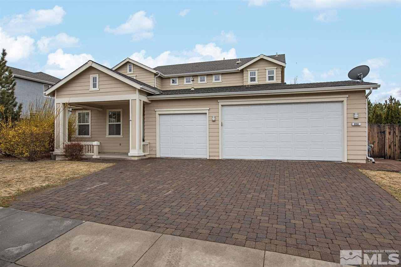 856 North University Park Loop Reno, NV 89512 - Photo 1 of 22 a front view of a house with a yard and garage