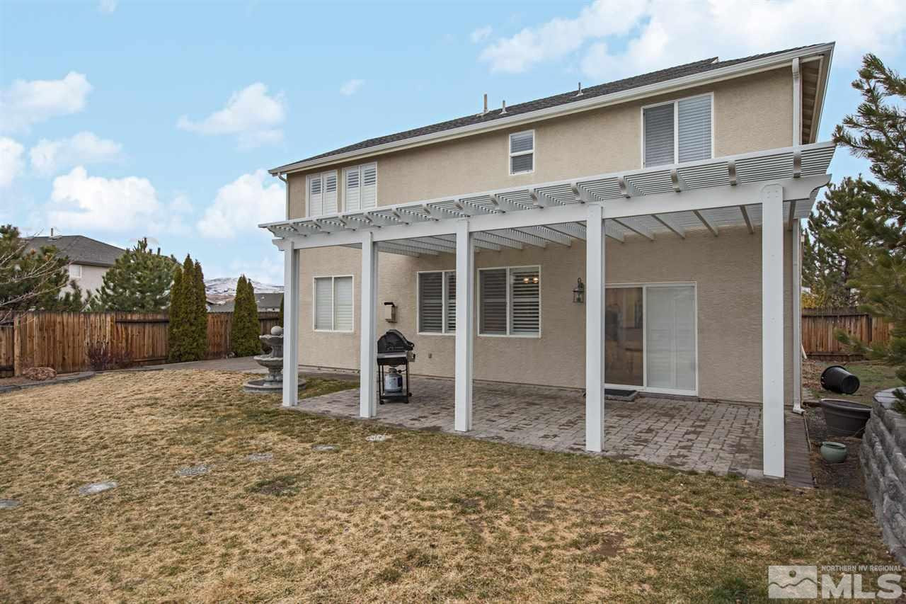 856 North University Park Loop Reno, NV 89512 - Photo 17 of 22 a backyard of a house with table and chairs