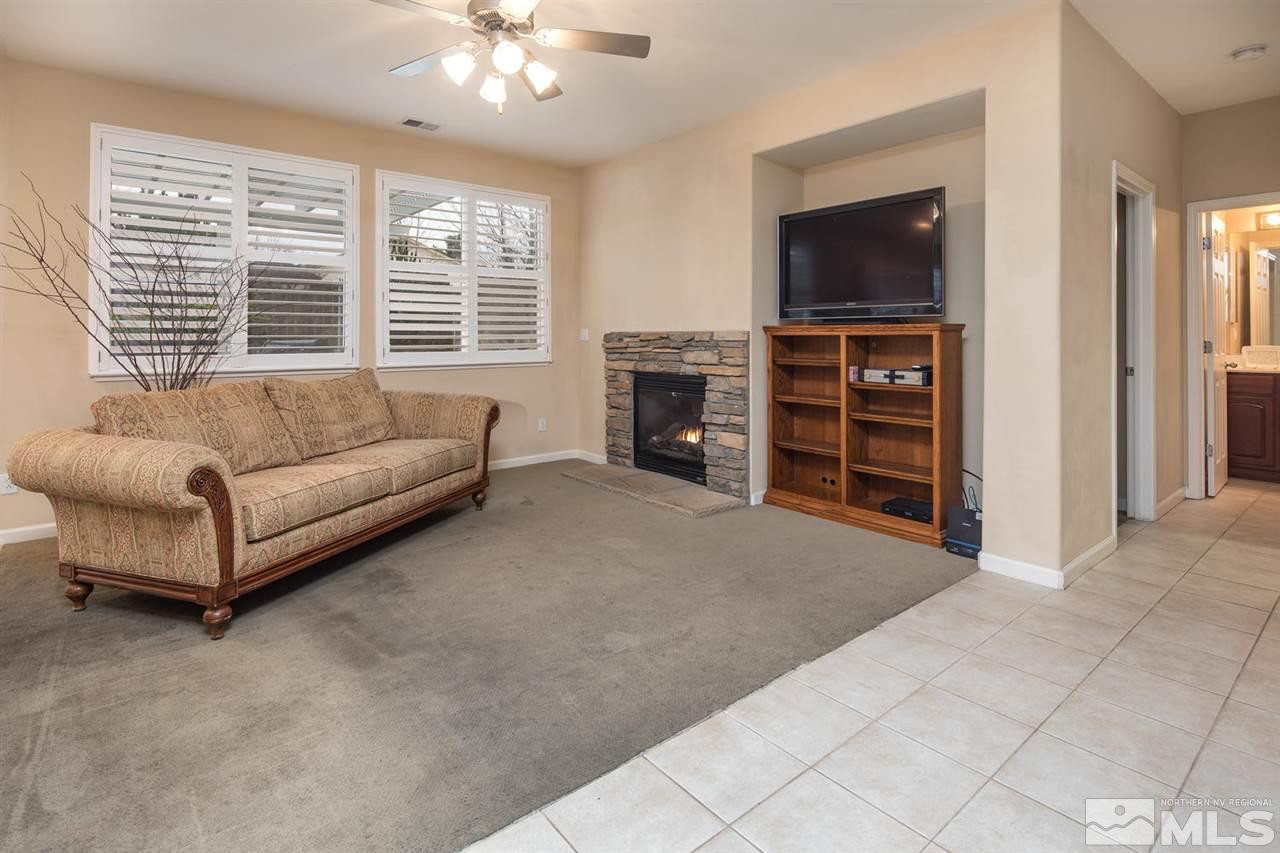 856 North University Park Loop Reno, NV 89512 - Photo 6 of 22 a living room with furniture and a flat screen tv