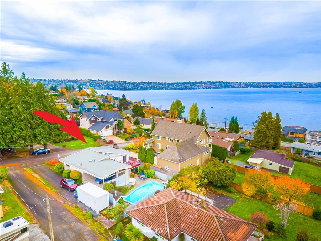 an aerial view of a houses with outdoor space