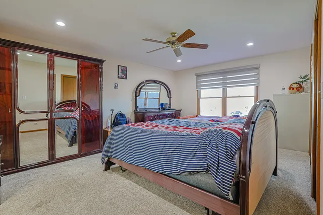 a bed room with a bed and a window