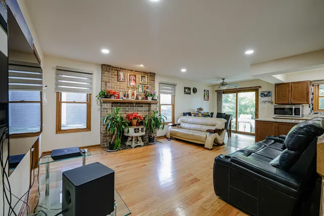 a living room with furniture fireplace and flat screen tv