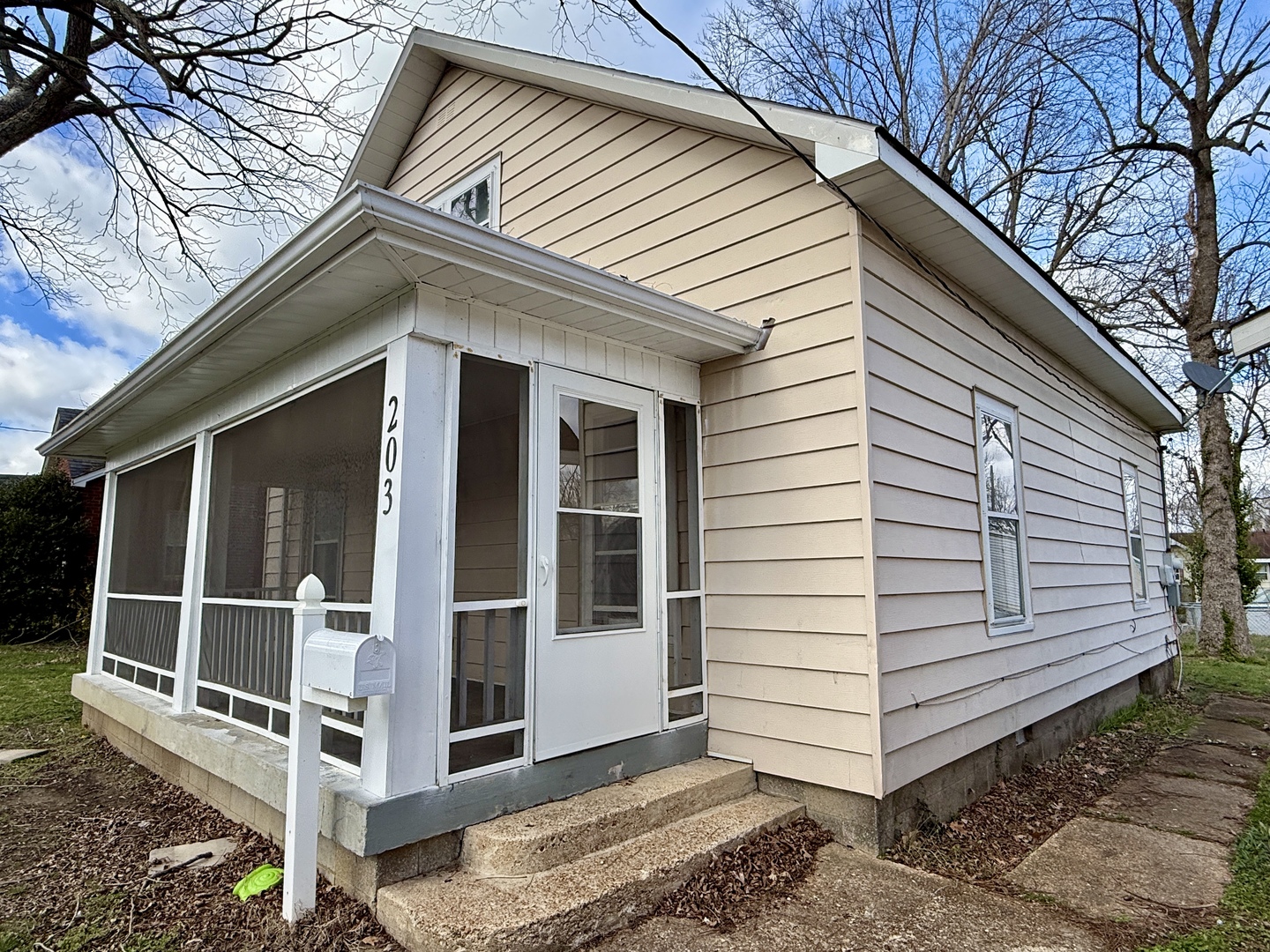 203 West 12th Street Metropolis, IL 62960 - Photo 25 of 27 a view of a house with a large window and wooden fence
