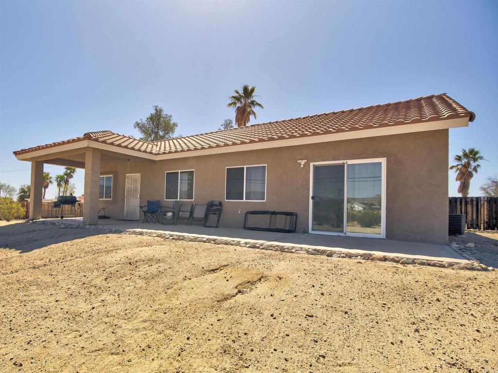 3302 Swinging V Road Borrego Springs, CA 92004 - Photo 12 of 14 a front view of a house with a yard and garage