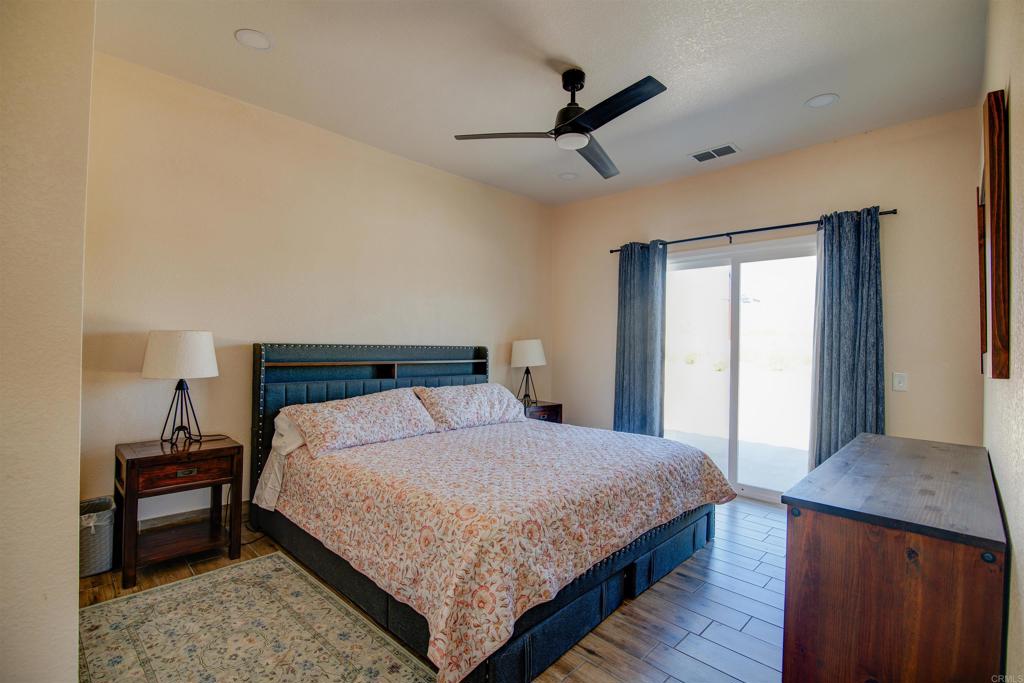3302 Swinging V Road Borrego Springs, CA 92004 - Photo 6 of 14 a bedroom with a bed and a dresser in it