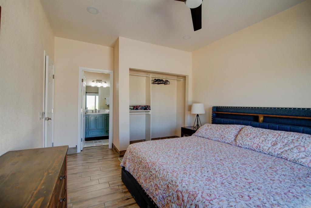 3302 Swinging V Road Borrego Springs, CA 92004 - Photo 7 of 14 a bedroom with a bed and painting on the wall