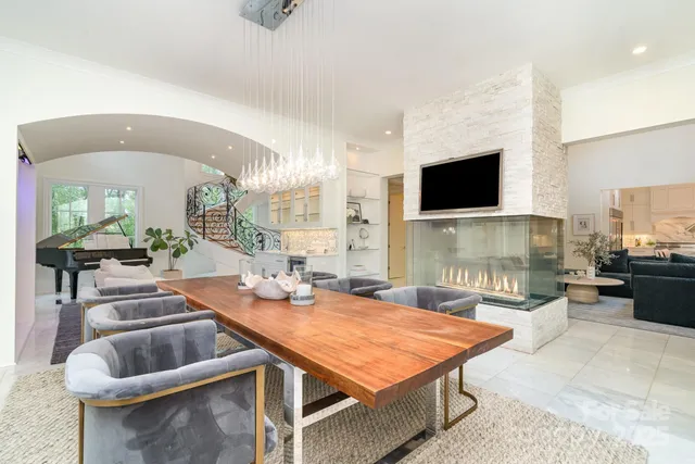 a kitchen with stainless steel appliances kitchen island granite countertop a stove and a sink