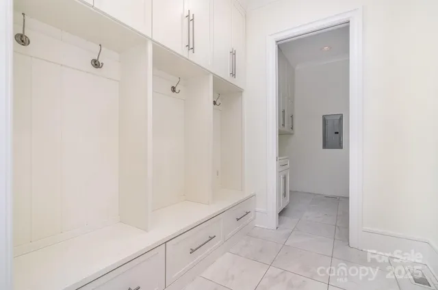a bathroom with a granite countertop sink and cabinets
