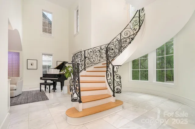 a view of an entryway with wooden floor