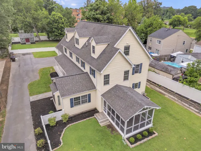 a aerial view of a house with a yard