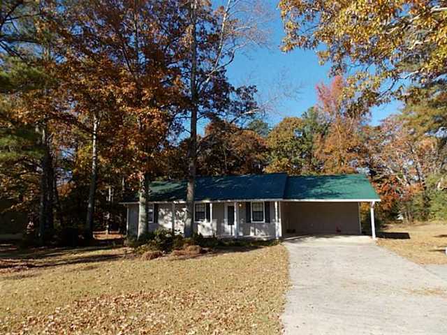 8216 Ephesus Church Road, Unit 2 Villa Rica, GA 30180 - Photo 1 of 1 a front view of a house with a yard covered with snow