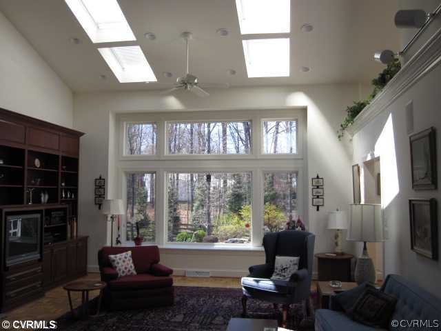 2300 Worchester Road Midlothian, VA 23113 - Photo 3 of 12 a living room with furniture fireplace and a large window