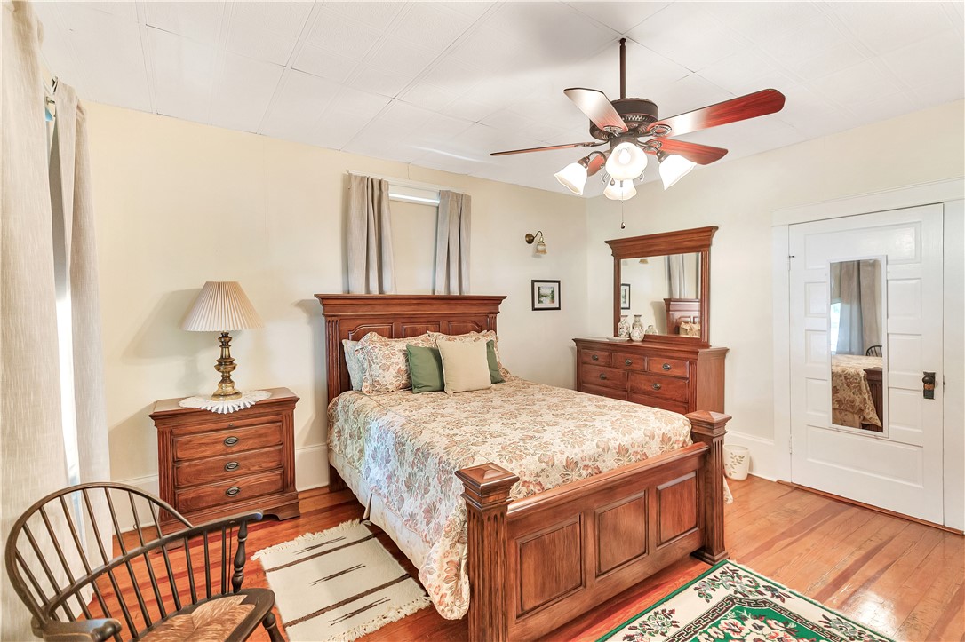 205 West Mauldin Street Walhalla, SC 29691 - Photo 17 of 43 A comforting bedroom retreat features rich hardwood floors and large closet space.