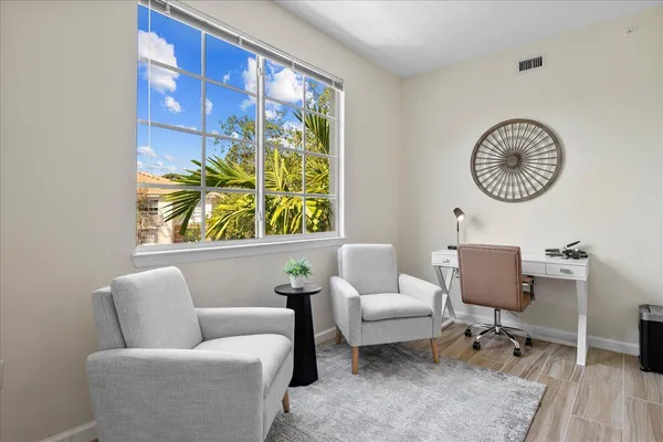 a living room with furniture and a window