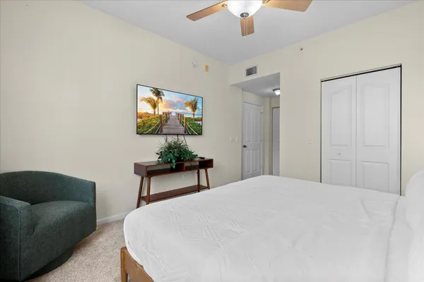 a bedroom with furniture and a chandelier