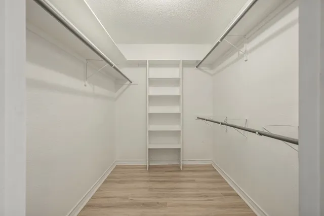 a view of an empty walk in closet