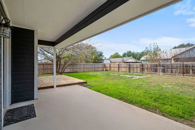 a view of outdoor space with deck and yard