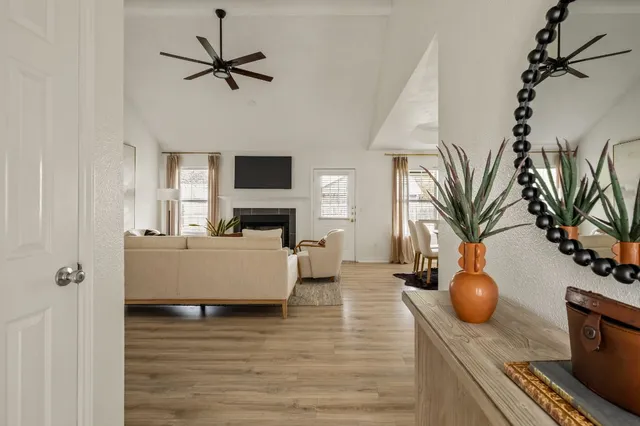 a living room with furniture and a fireplace