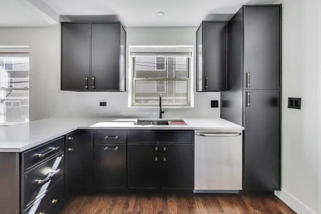 a view of a kitchen cabinets and wooden floor