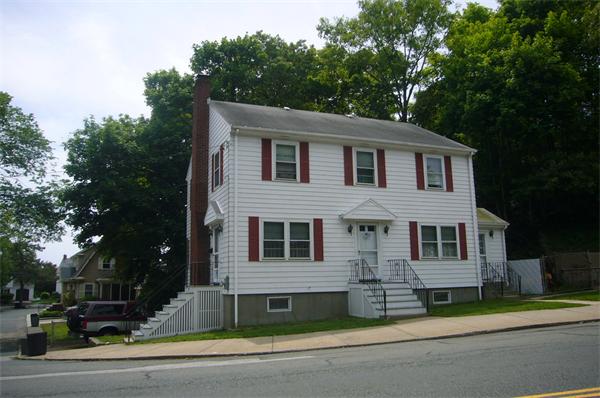 1 Pine Point Road Lynn, MA 01904 - Photo 15 of 15 a front view of a house with a garden