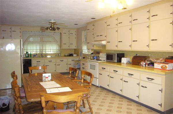 1 Pine Point Road Lynn, MA 01904 - Photo 5 of 15 a kitchen with cabinets and chairs
