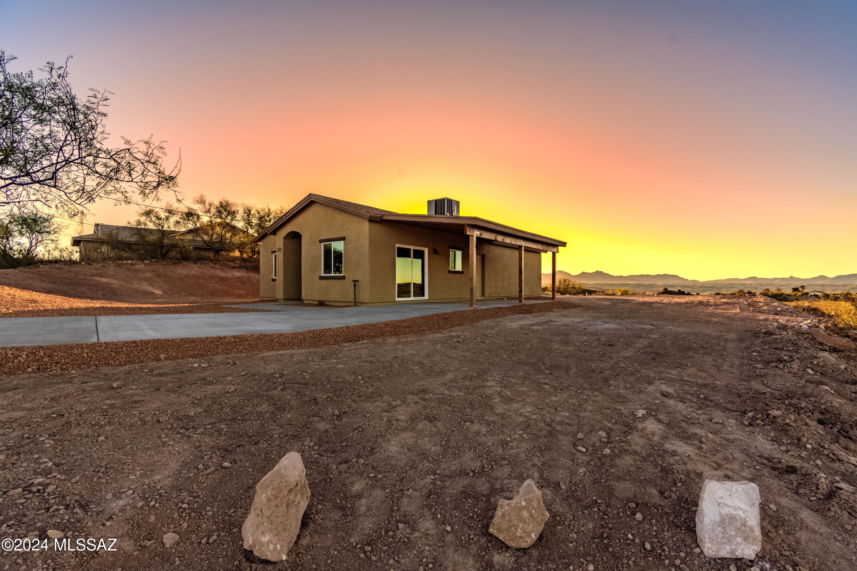 221 Paseo Mascota Rio Rico, AZ 85648 - Photo 2 of 45 a view of a house with a yard