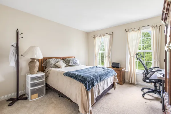 a bed room with a bed and a couch