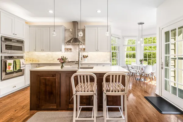 a kitchen with a kitchen island wooden cabinets and counter space