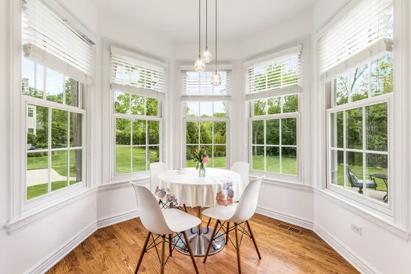a large kitchen with stainless steel appliances lots of counter space and windows