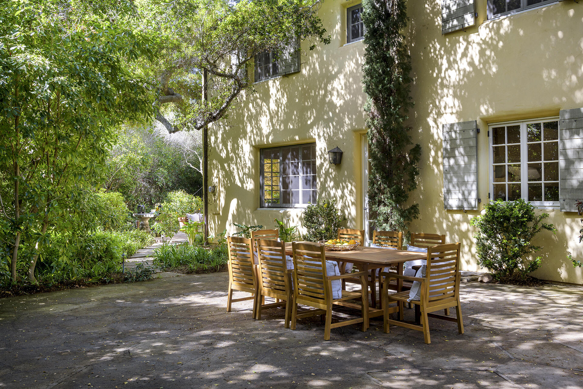 640 El Bosque Road Montecito, CA 93108 - Photo 11 of 36 a view of a patio with table and chairs and potted plants