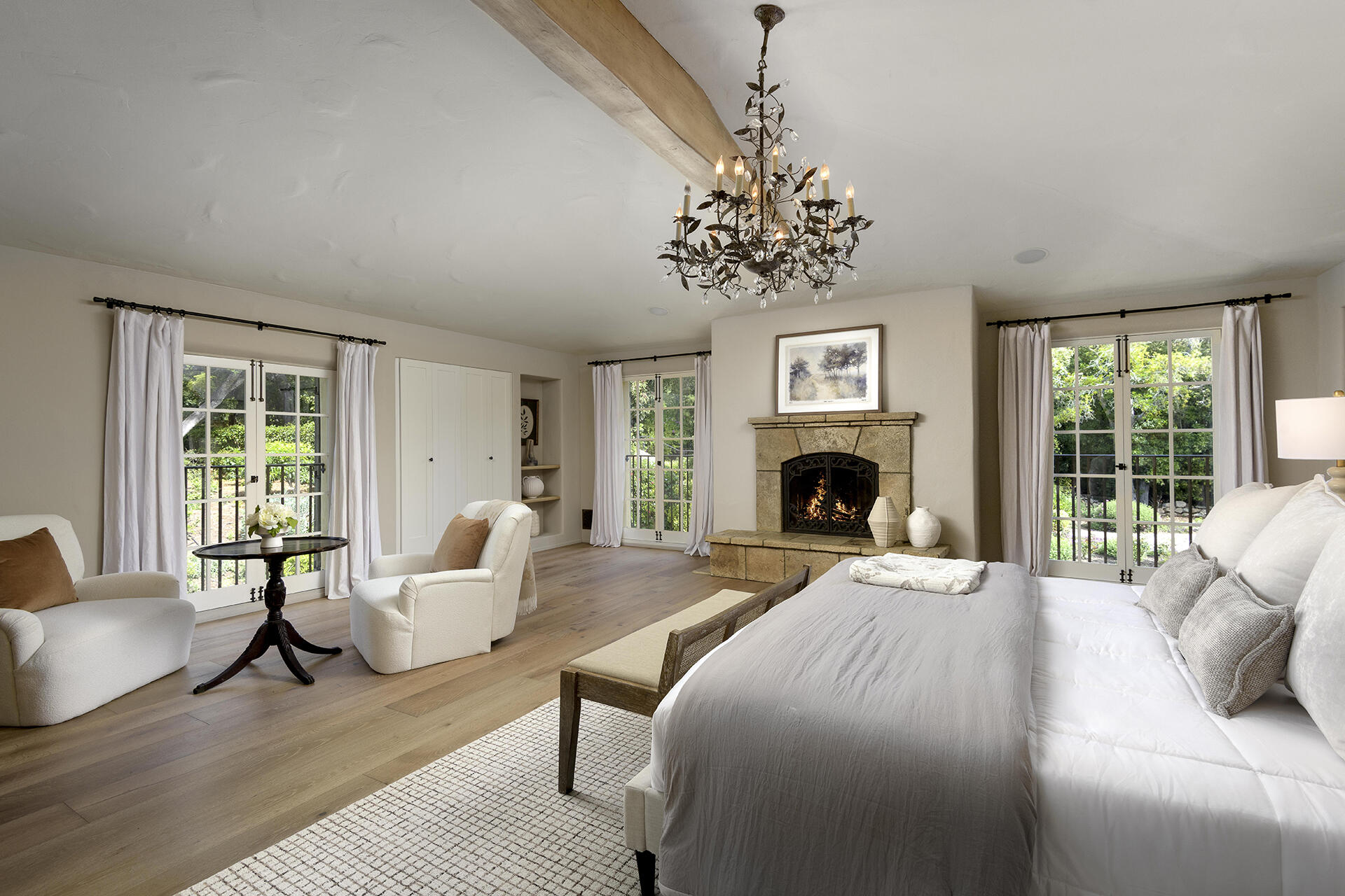 640 El Bosque Road Montecito, CA 93108 - Photo 15 of 36 a large bedroom with a bed and a fireplace