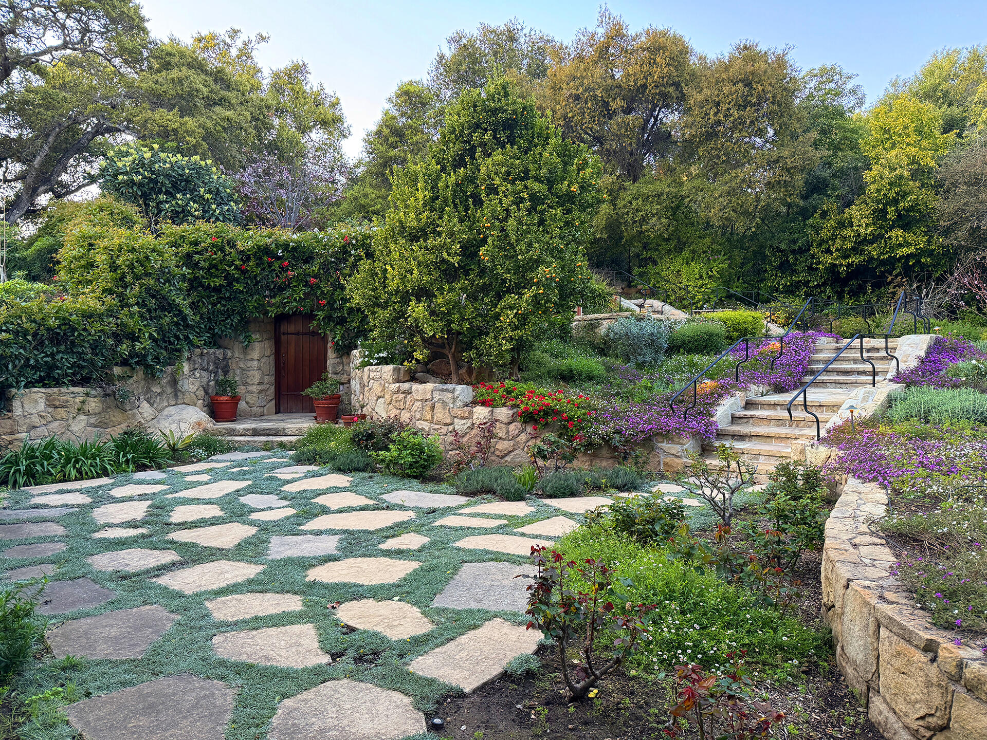 640 El Bosque Road Montecito, CA 93108 - Photo 30 of 36 a backyard of a house with a yard and outdoor seating