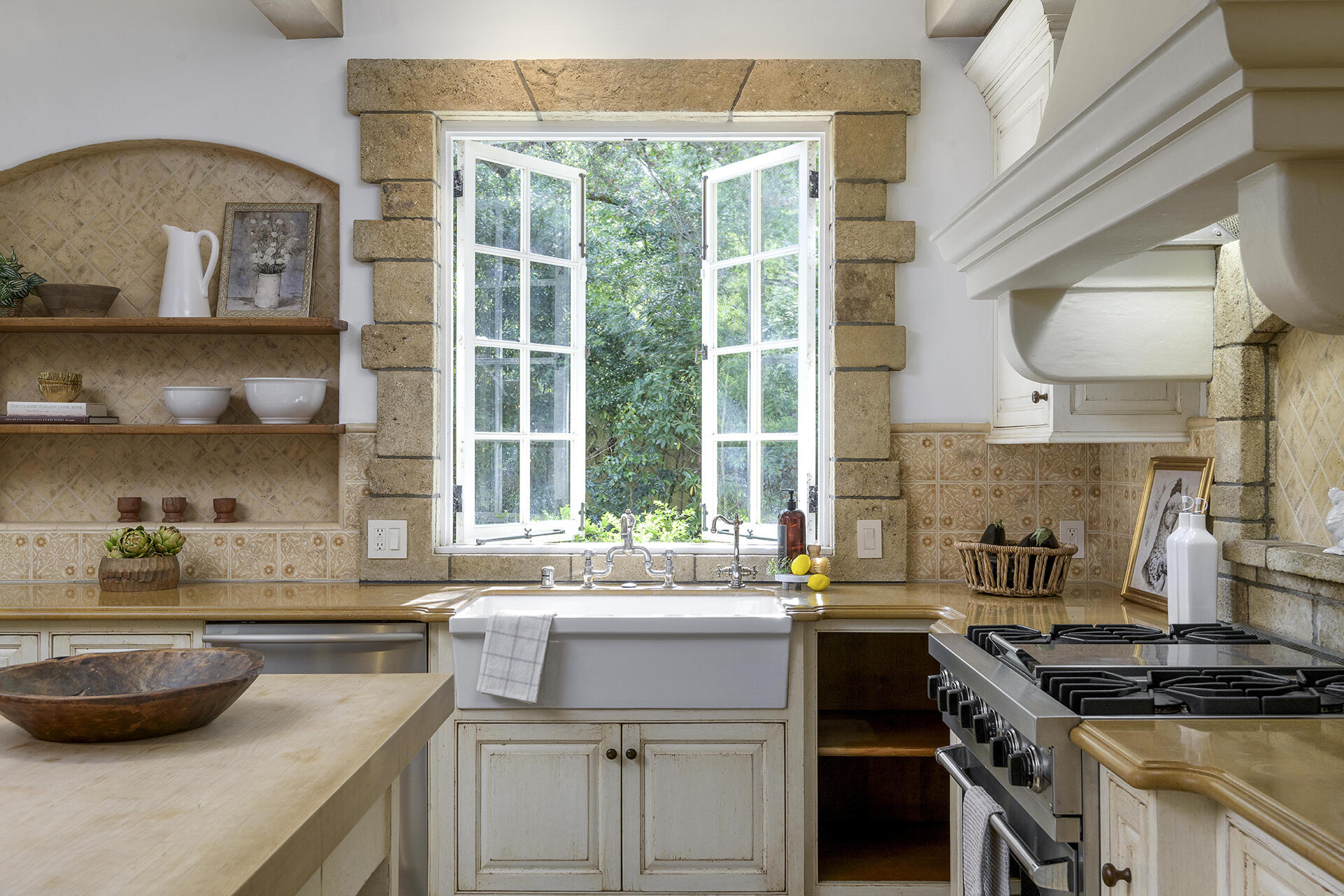 640 El Bosque Road Montecito, CA 93108 - Photo 9 of 36 a kitchen with a sink a stove cabinets and a window