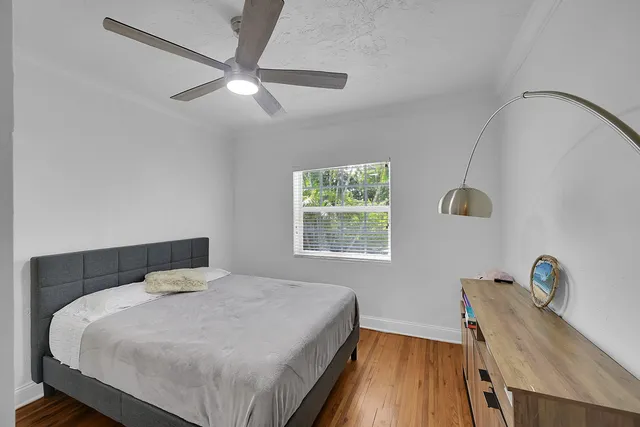 a bedroom with a bed and a table