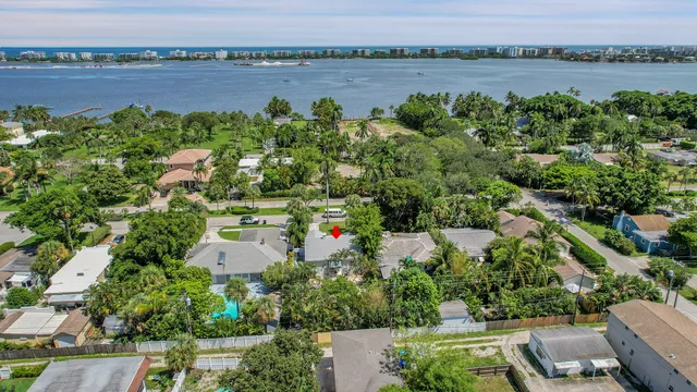 an aerial view of a house with a lake view
