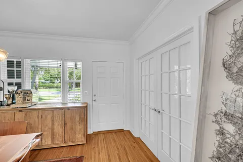 a view of a livingroom with wooden floor and a window