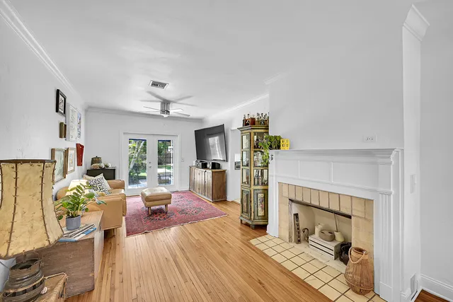 a living room with furniture and a fireplace