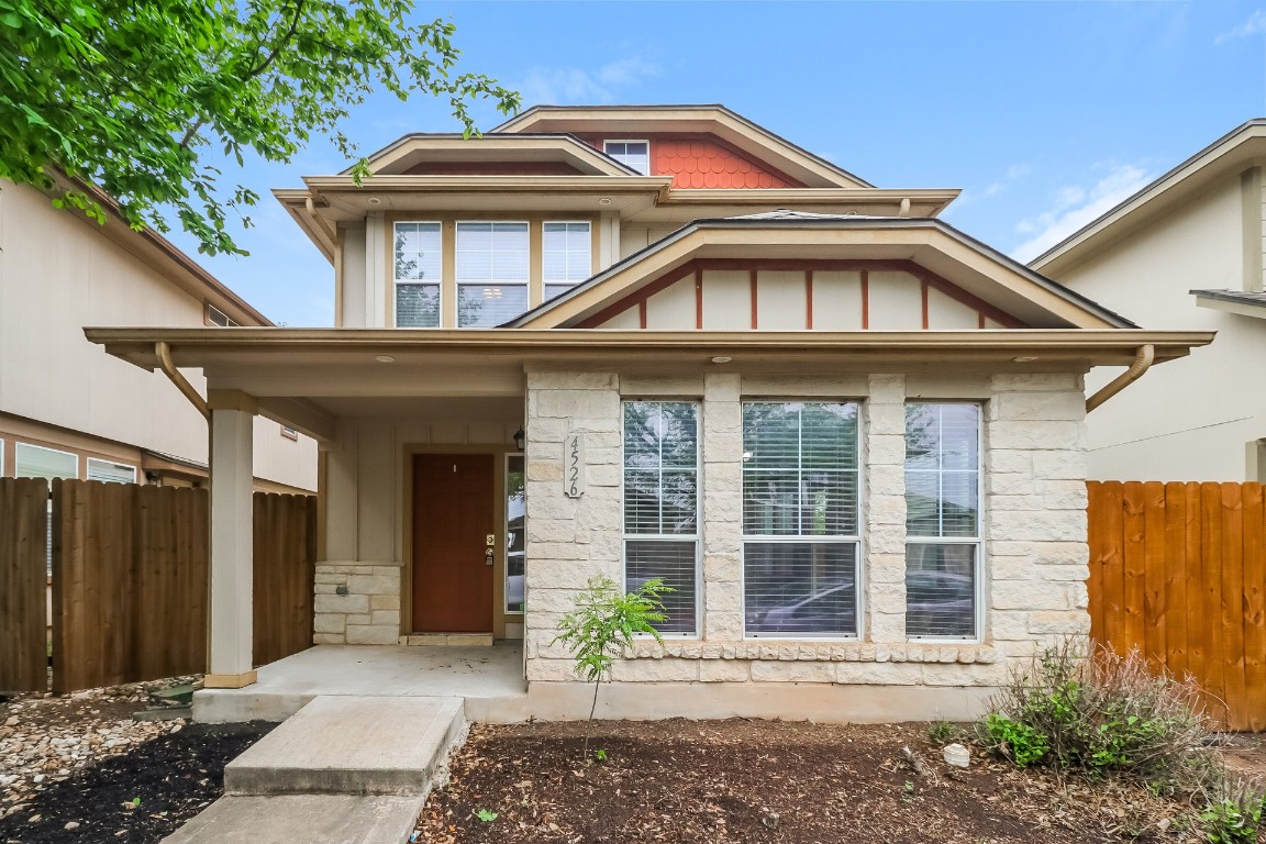4526 Felicity Lane Austin, TX 78725 - Photo 1 of 27 a front view of a house with a garden