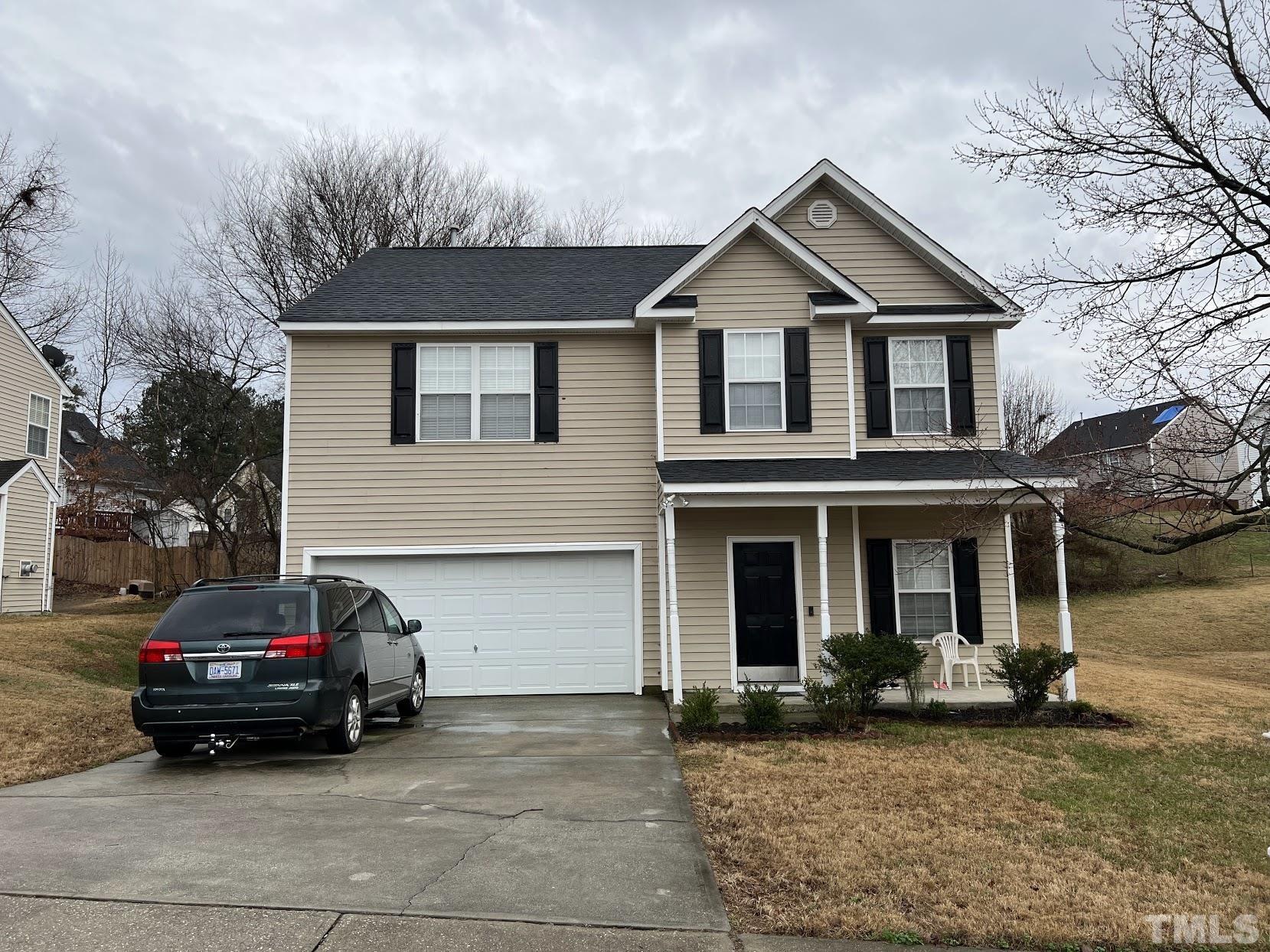 a car parked in front of a house