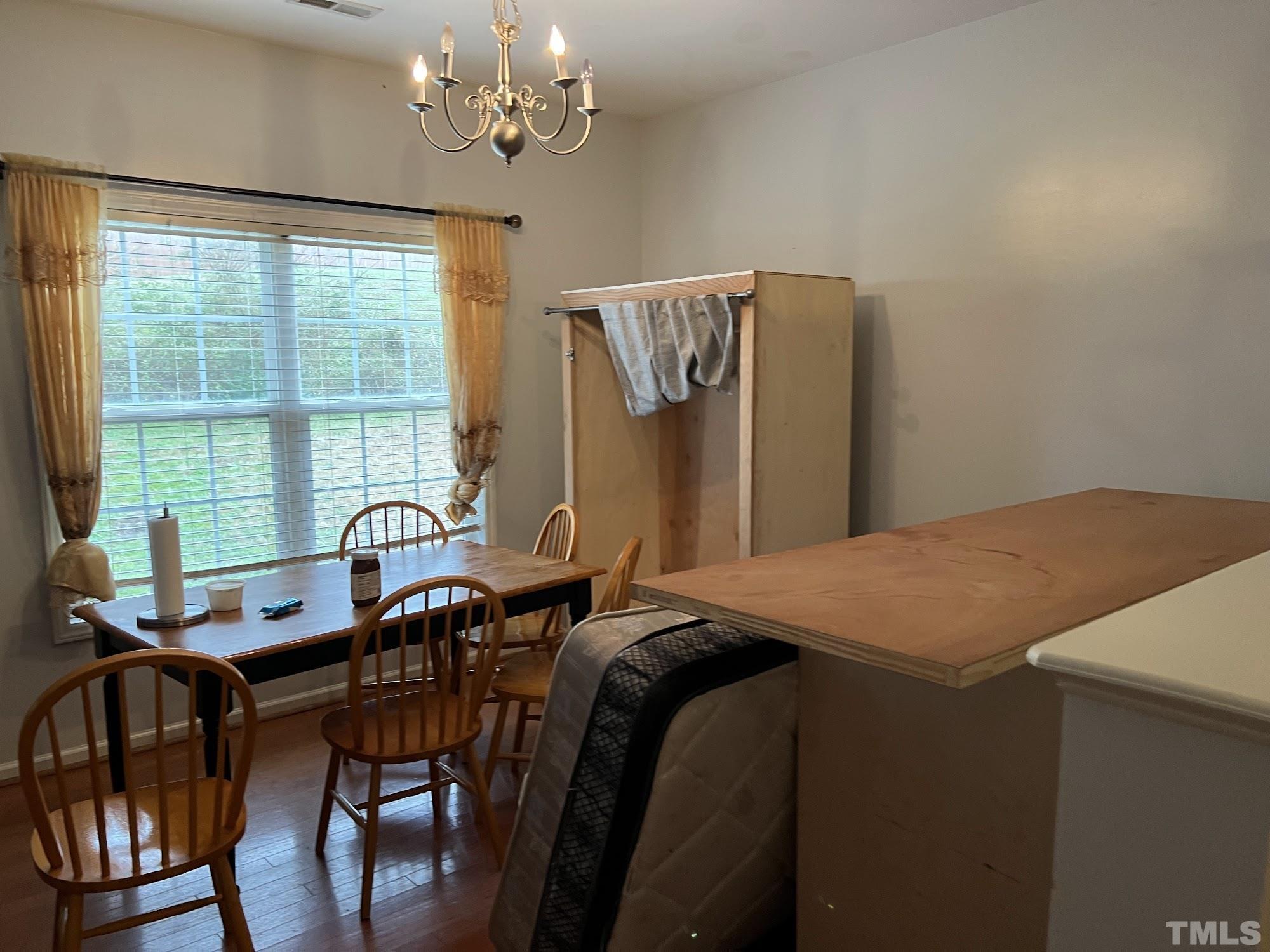 4109 Bay Rum Lane Raleigh, NC 27610 - Photo 15 of 31 a bedroom with a bed and a table