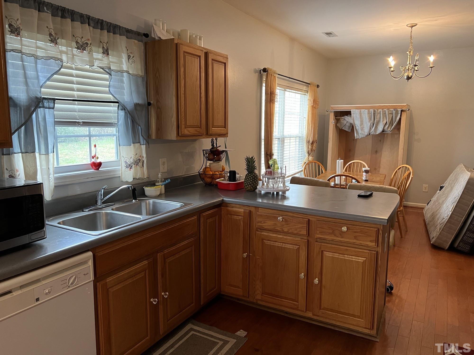4109 Bay Rum Lane Raleigh, NC 27610 - Photo 23 of 31 a kitchen with a sink and cabinets