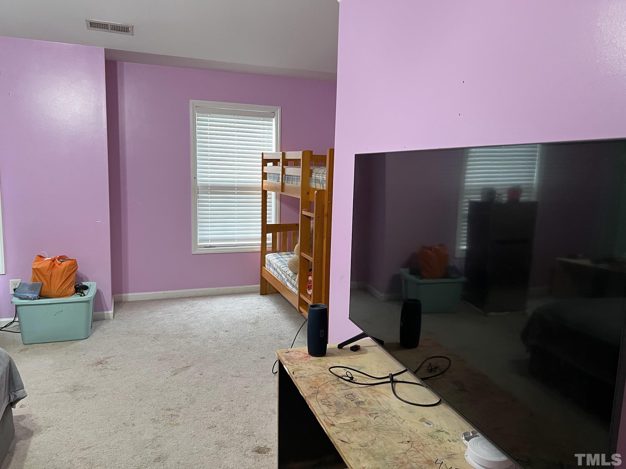 4109 Bay Rum Lane Raleigh, NC 27610 - Photo 3 of 31 a room with furniture and gym equipment