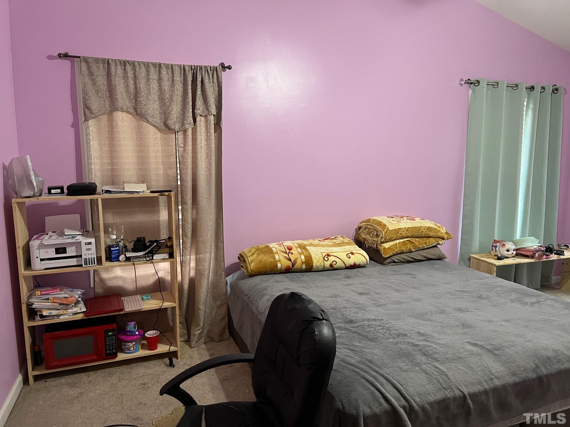 4109 Bay Rum Lane Raleigh, NC 27610 - Photo 6 of 31 a bedroom with a bed and a window