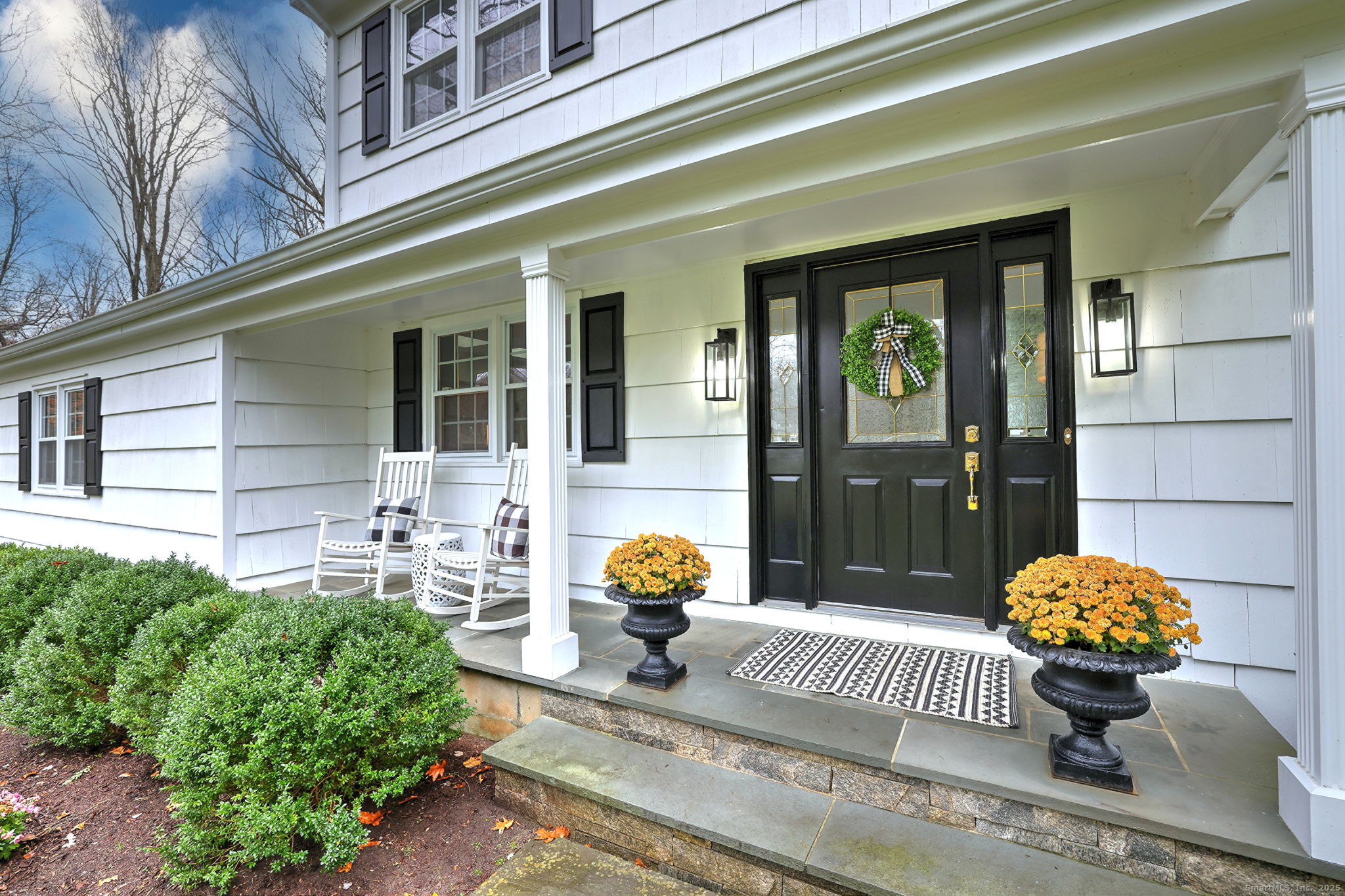 119 Wedgemere Road Stamford, CT 06905 - Photo 1 of 40 a front view of a house with outdoor seating yard and seating space