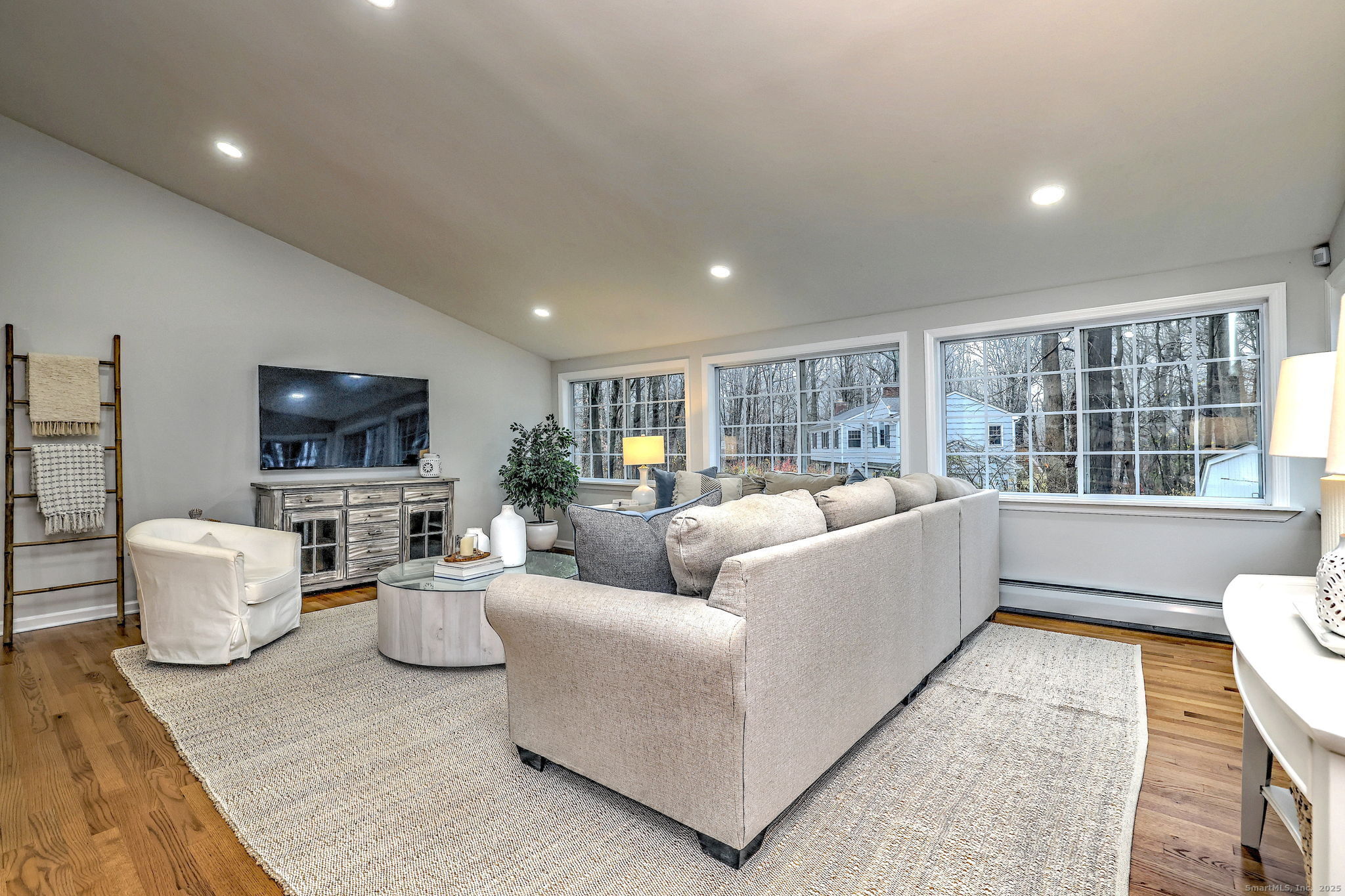 119 Wedgemere Road Stamford, CT 06905 - Photo 12 of 40 a living room with furniture and a flat screen tv