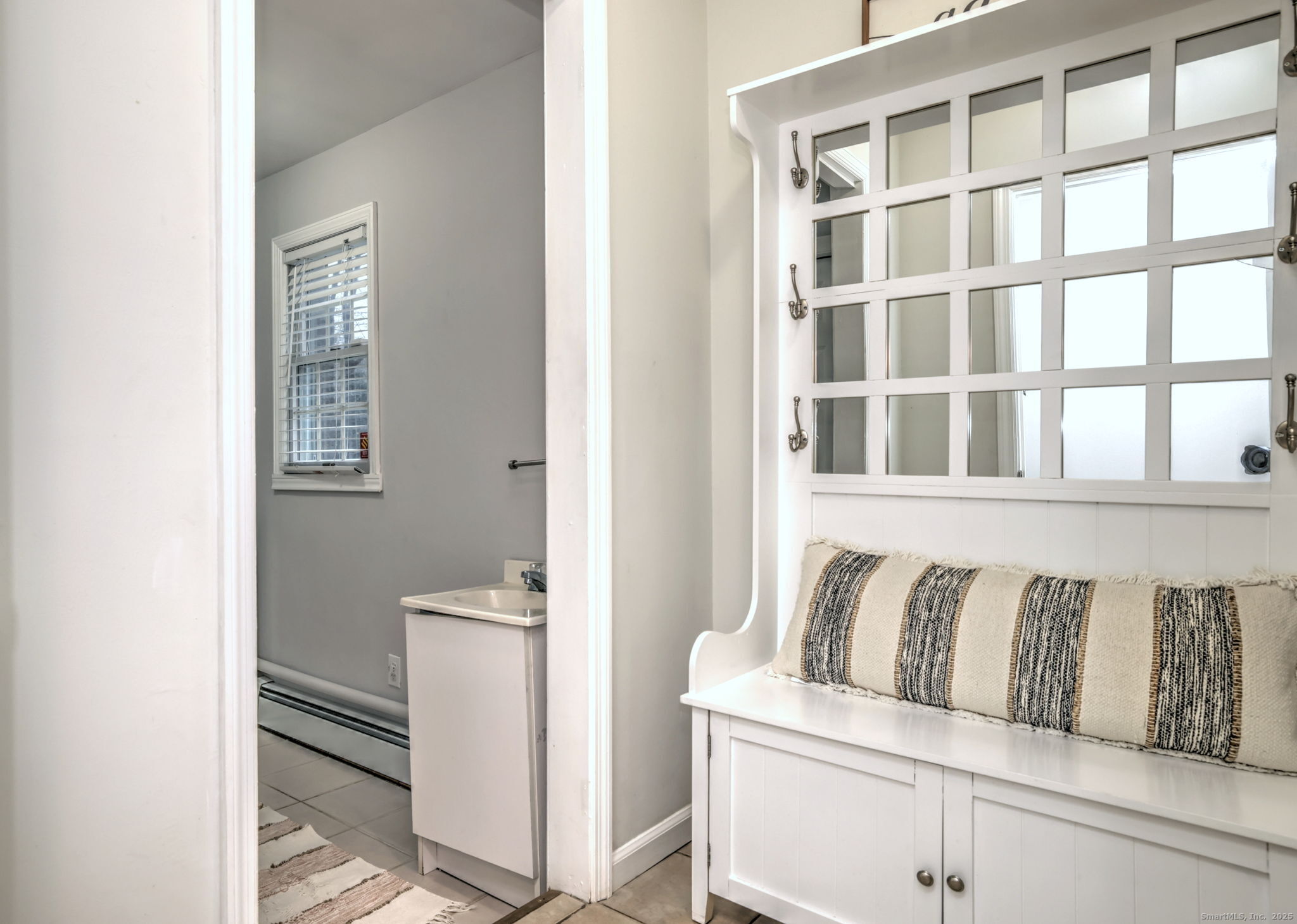 119 Wedgemere Road Stamford, CT 06905 - Photo 19 of 40 a living room with a couch and a window