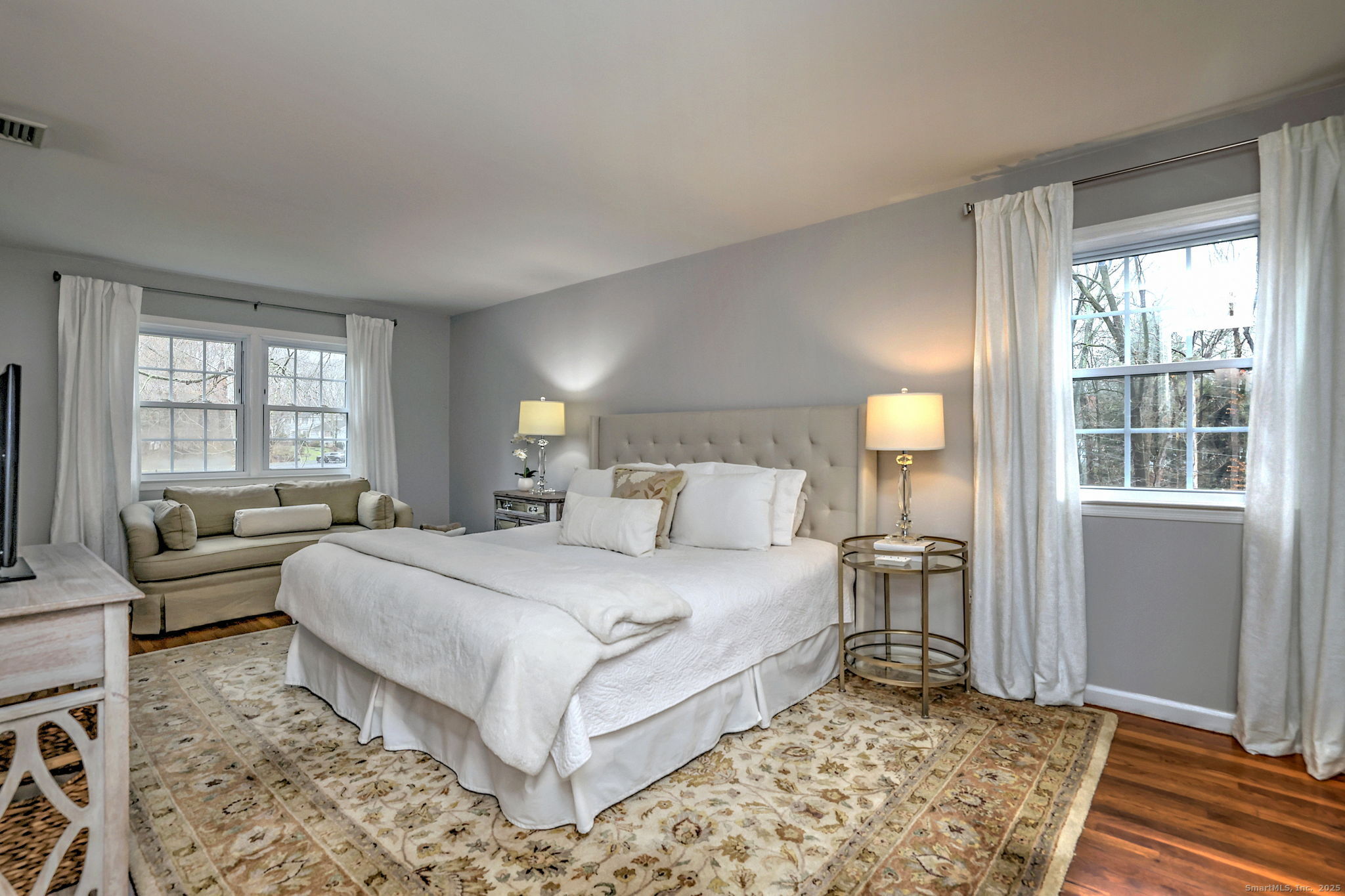 119 Wedgemere Road Stamford, CT 06905 - Photo 22 of 40 a bedroom with a large bed and a couch