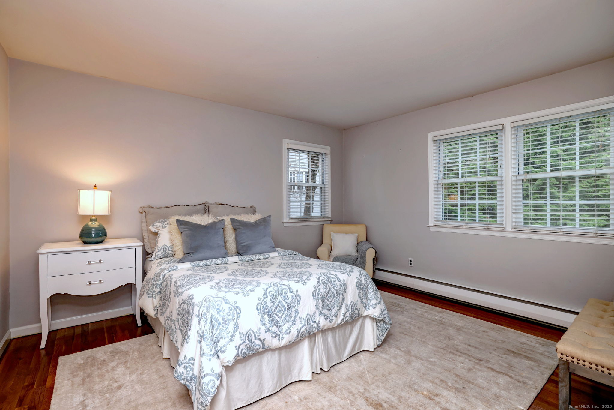 119 Wedgemere Road Stamford, CT 06905 - Photo 25 of 40 a bedroom with a bed and large windows