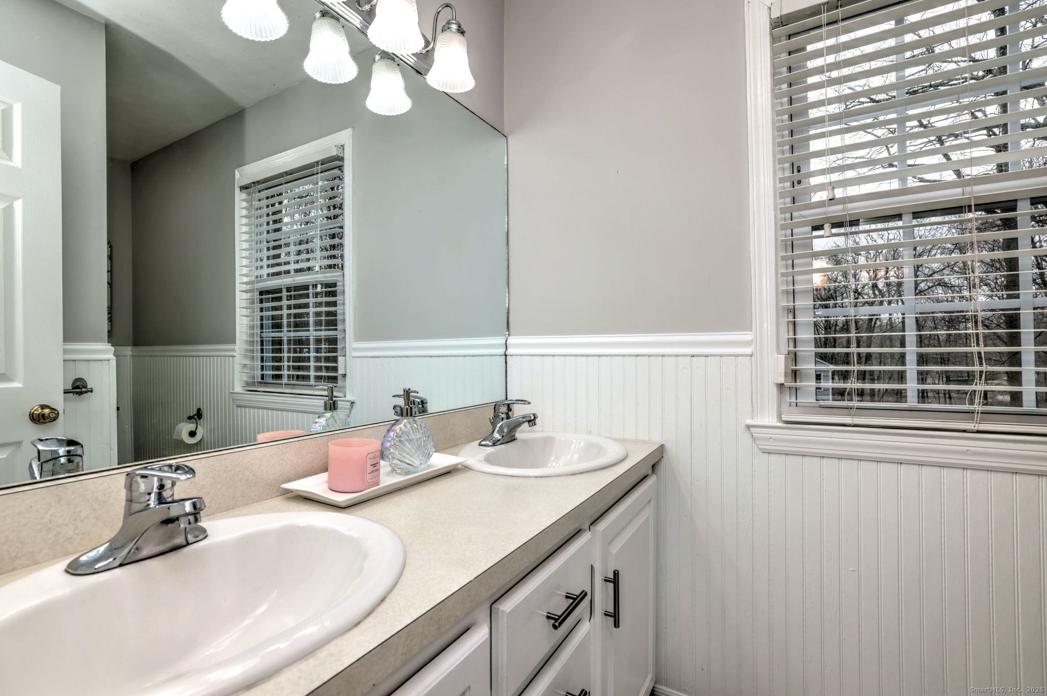 119 Wedgemere Road Stamford, CT 06905 - Photo 29 of 40 a bathroom with a granite countertop sink and a large mirror